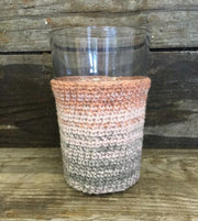 Crocheted glass cosy with dip dye color change, made in Isager Spinni yarn