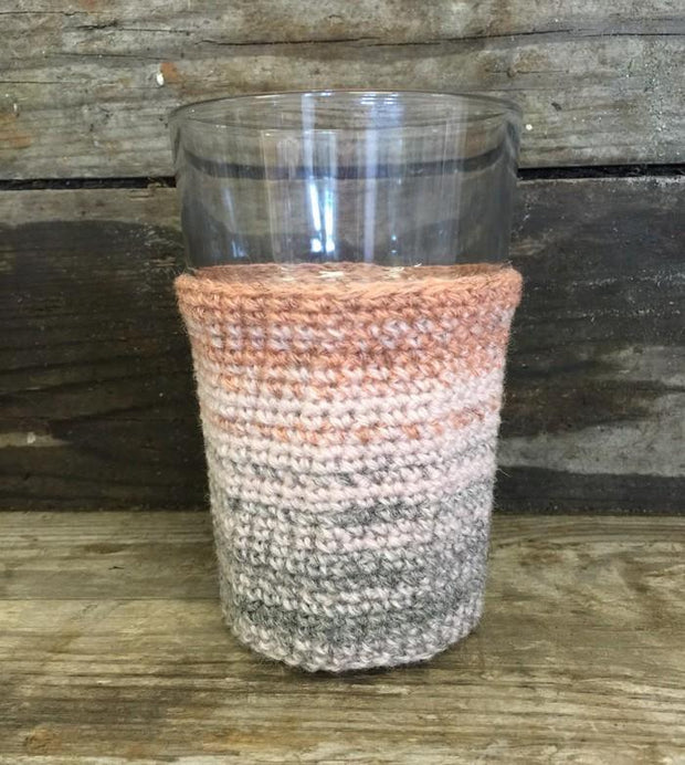 Crocheted glass cosy with dip dye color change, made in Isager Spinni yarn